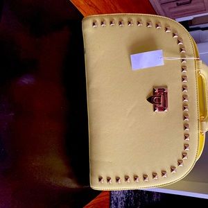 Yellow purse with adjustable straps